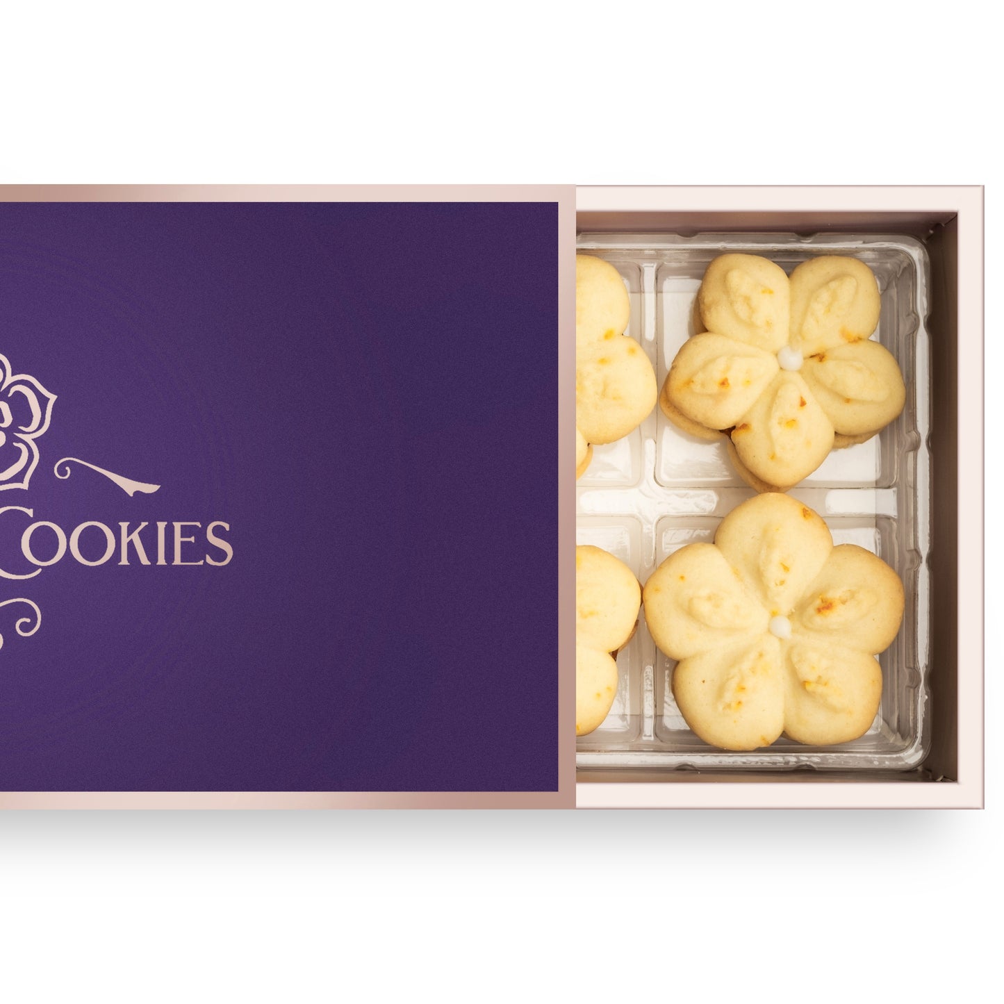 Open box of eight handcrafted citrus-vanilla cookies with apricot jam filling, arranged for gifting or indulgence.